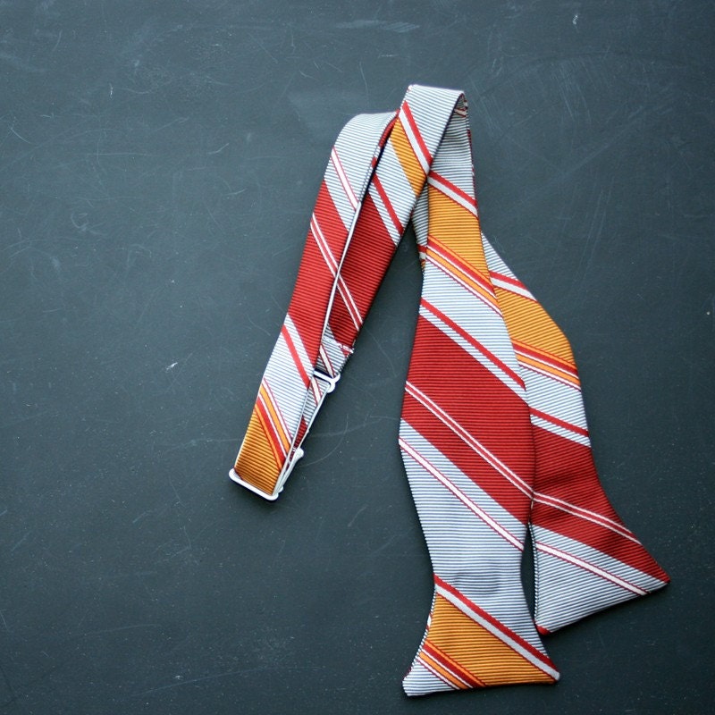 red, yellow, and gray striped bow tie