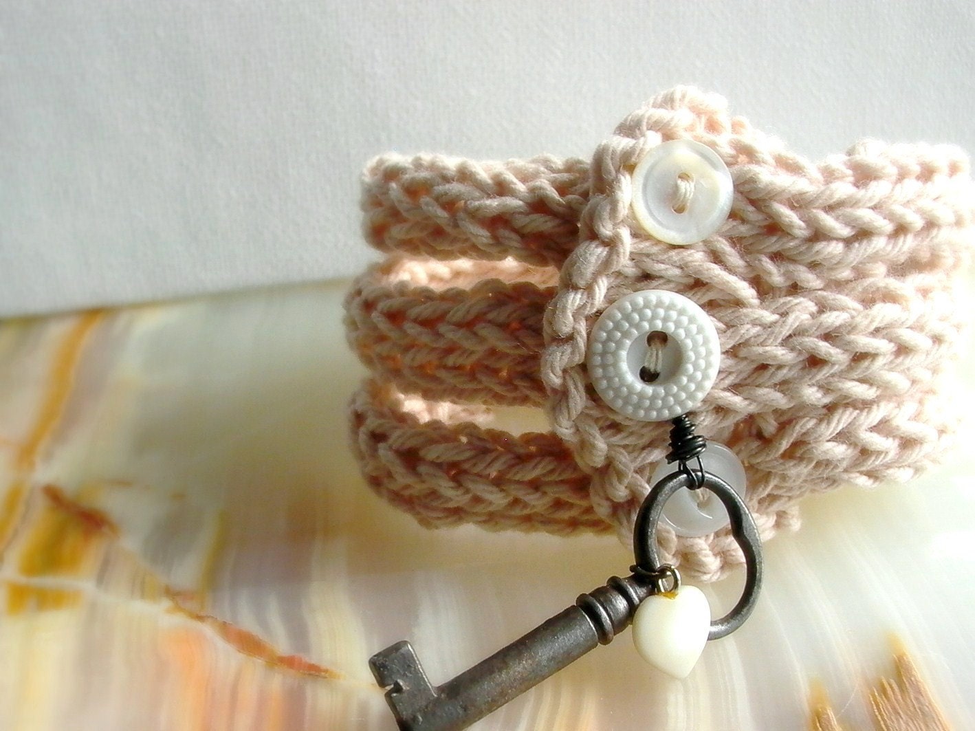 Forever in my Heart Secret Love . handknit bangles with vintage trinkets