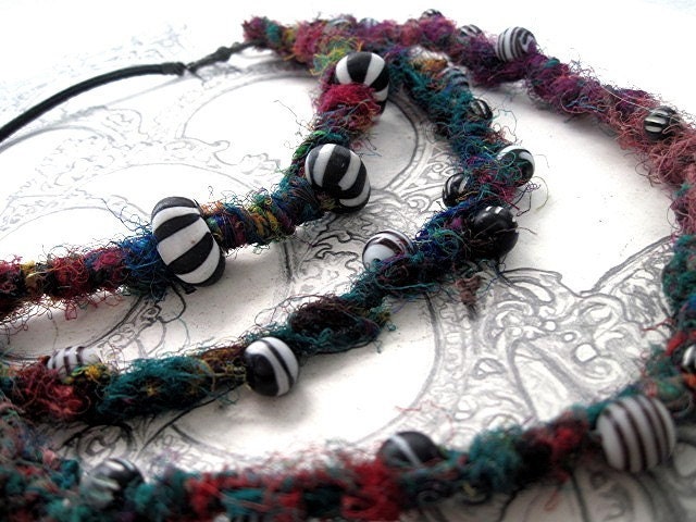 A song for my unseen friends.  Recycled Sari Yarn and Trade Beads.
