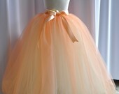 Peaches and Cream Flower Girl Tutu for Weddings. Available in several color combinations. This is a two in one tutu and reverses. 26 inches long. Princess length on little girls. Entirely sewn tutu.