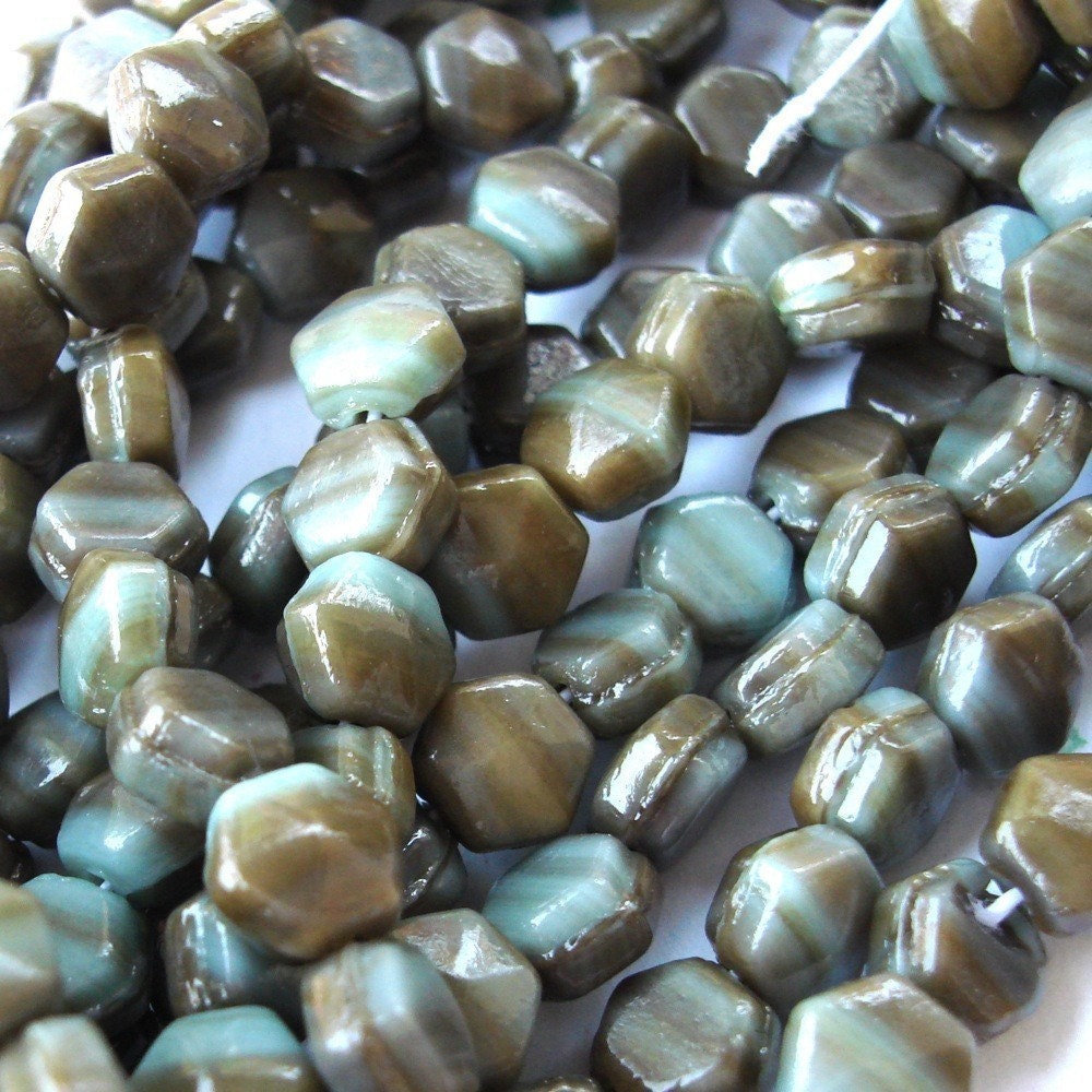 PALE TURQUOISE AND BROWN MUSHROOM NAILHEAD BEADS.   WAY BACK WHEN THE HEAD OF NAILS WERE SIX SIDED A BRILLIANT BEAD MAKER THOUGHT THAT NAILHEAD WAS A GOOD SHAPE FOR A BEAD.  5MM  (20) GB108