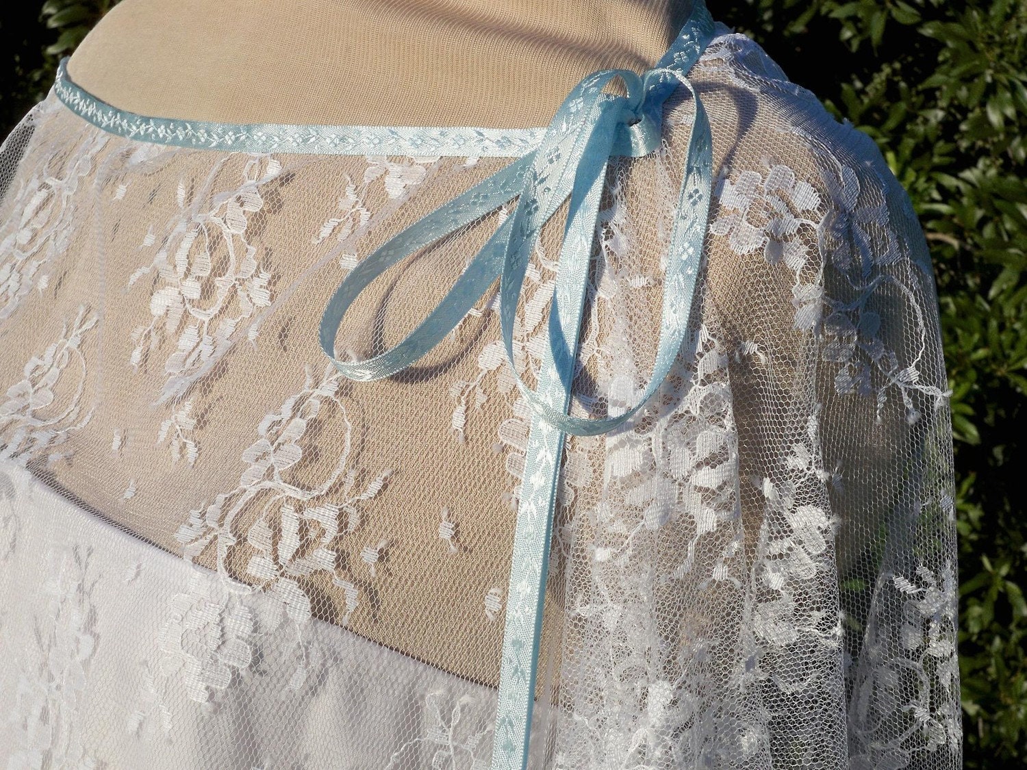 Chantilly lace drape in white.... and just a touch of blue... One size fits many