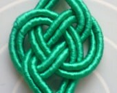 Two vibrant green art silk tassels