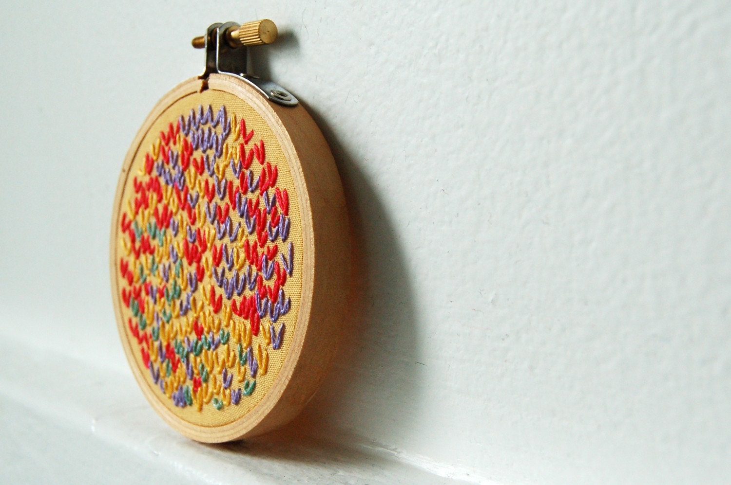 Hand Embroidery in 3 inch Hoop. Orange, Purple, Yellow. Wishbone Stitch Color Circle. West Coast Sun. Handmade by Merriweathercouncil on Etsy