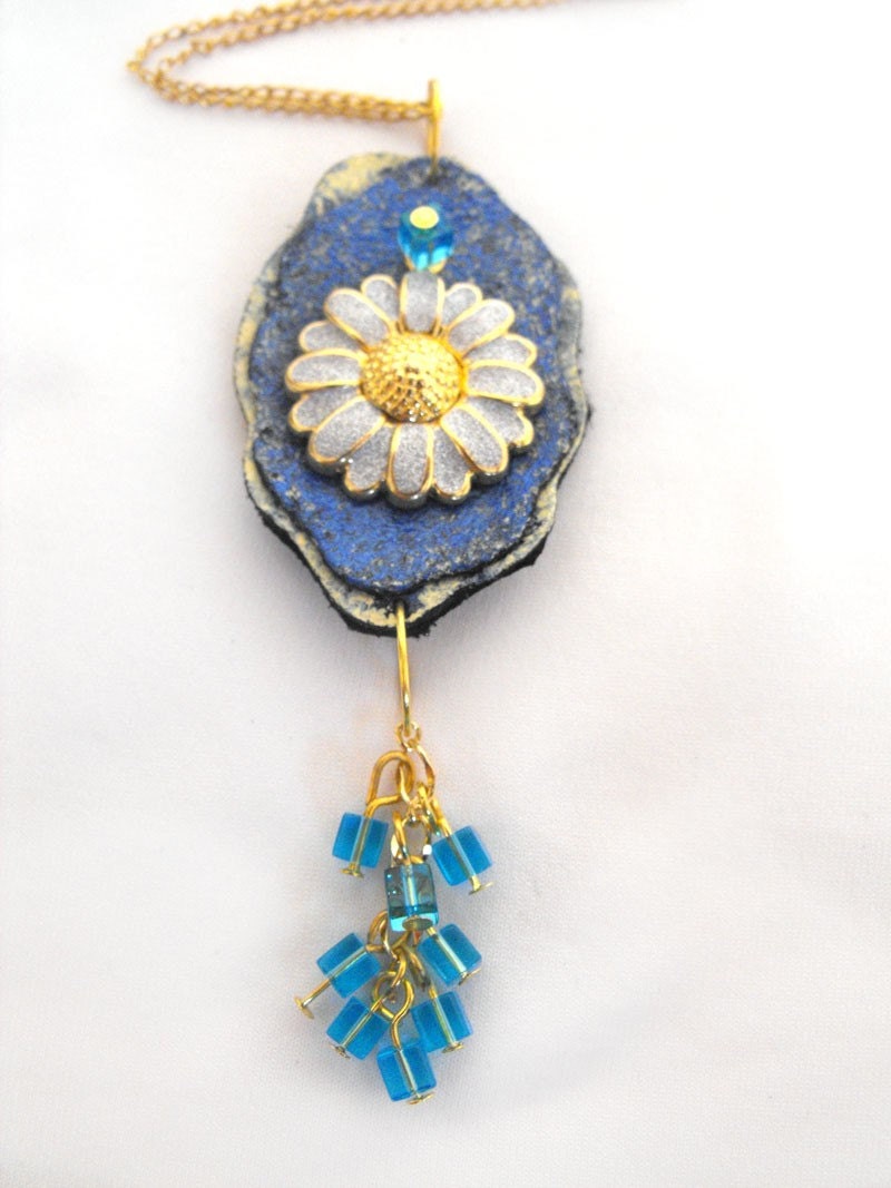 Flower pendant. Shades of blue and yellow leather flower pendant with chamomile charm. Comes with a chain.