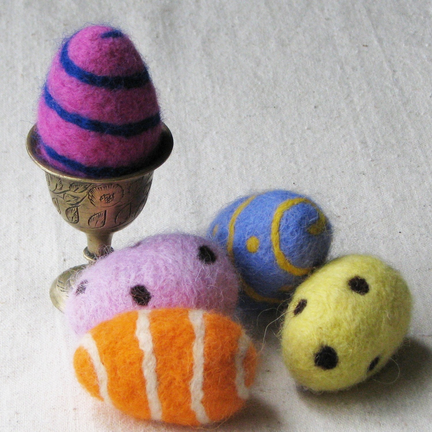 Easter eggs, needle felted from colorful wool in pink, yellow, orange, and blue, set of 5