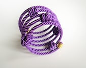 Rope wrapped memory wire cuff bracelet with knots purple