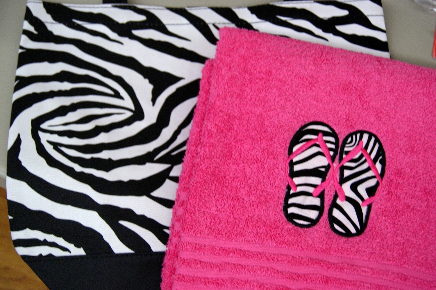 Personalized zebra tote bag with hot pink beach towel appliqued with zebra flip flops