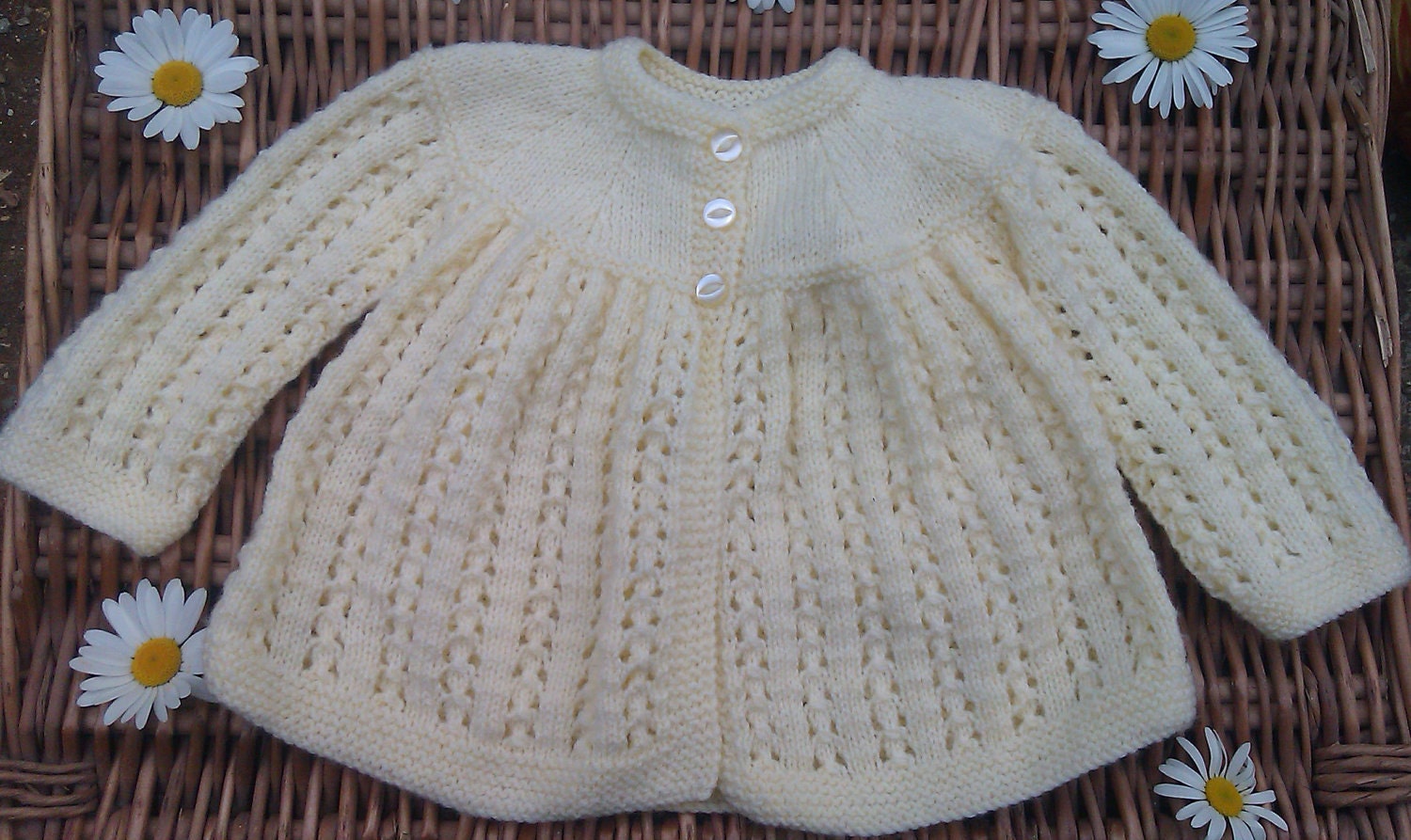 Baby's traditional yellow lacy matinee jacket