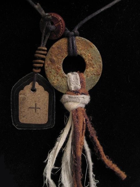 urban shaman's amulet with vintage tag and rusty wire