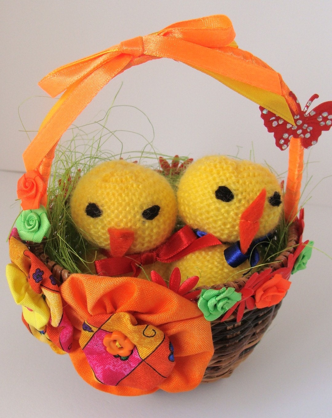 Easter basket decoration with knitted chicks