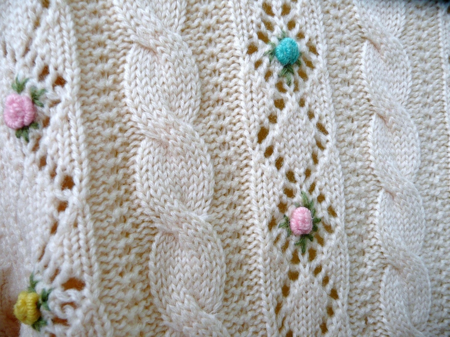 button sweater in cream wool with yellow, turquoise and pink flowers by Barbara Lee Passport Collection