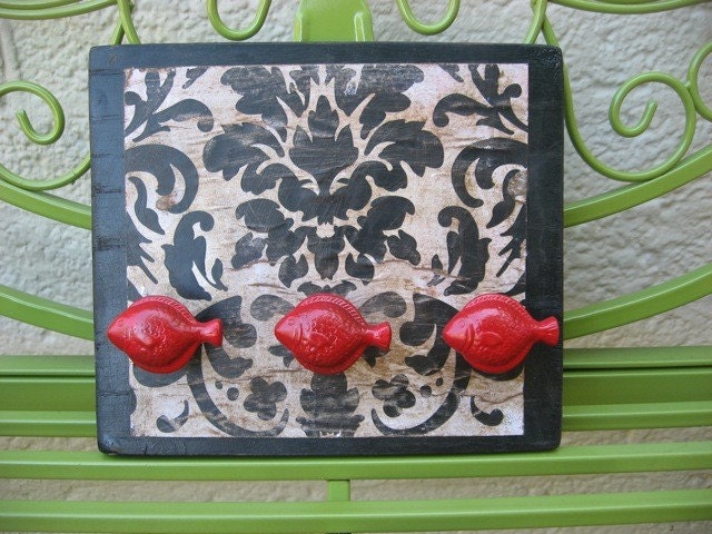 Wall Hooks 
with Red Fish Knobs As Hangers