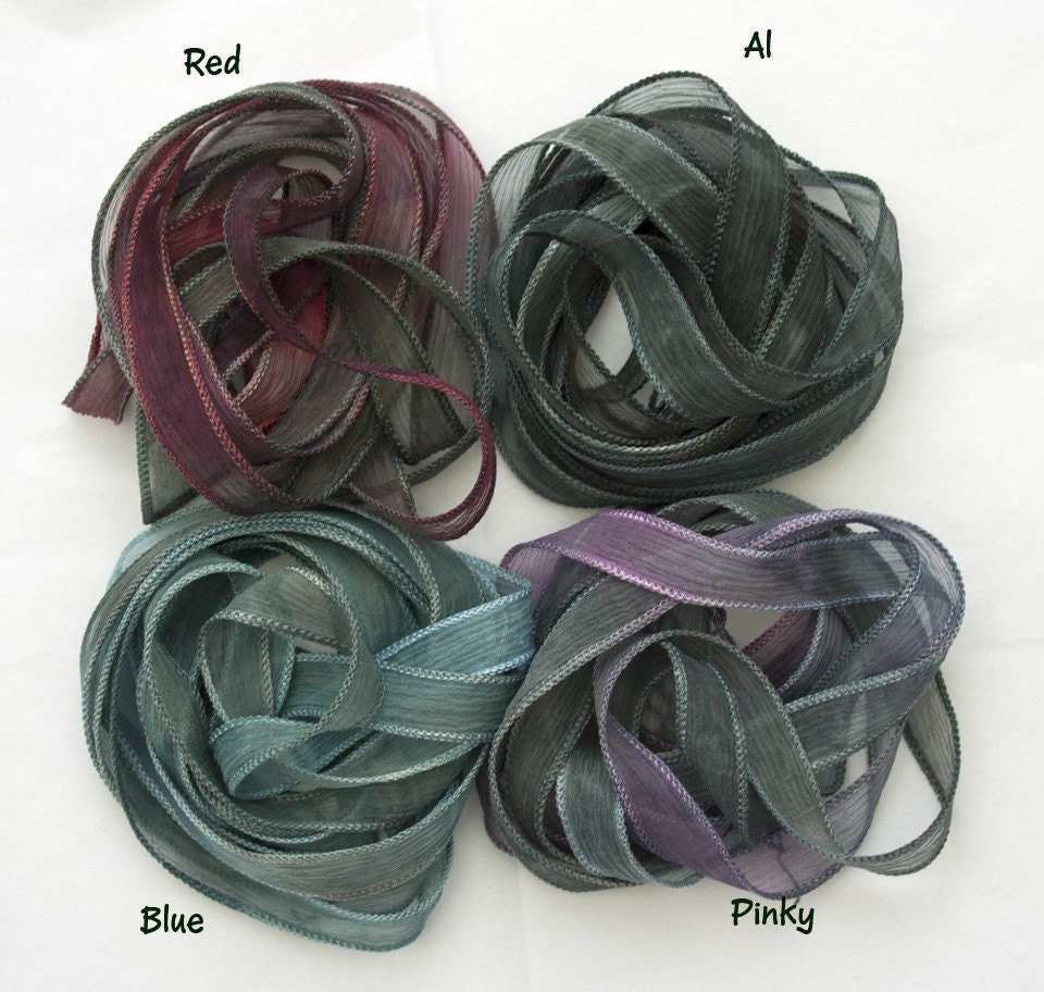 Four pure silk ribbons all with a base of variegated greys