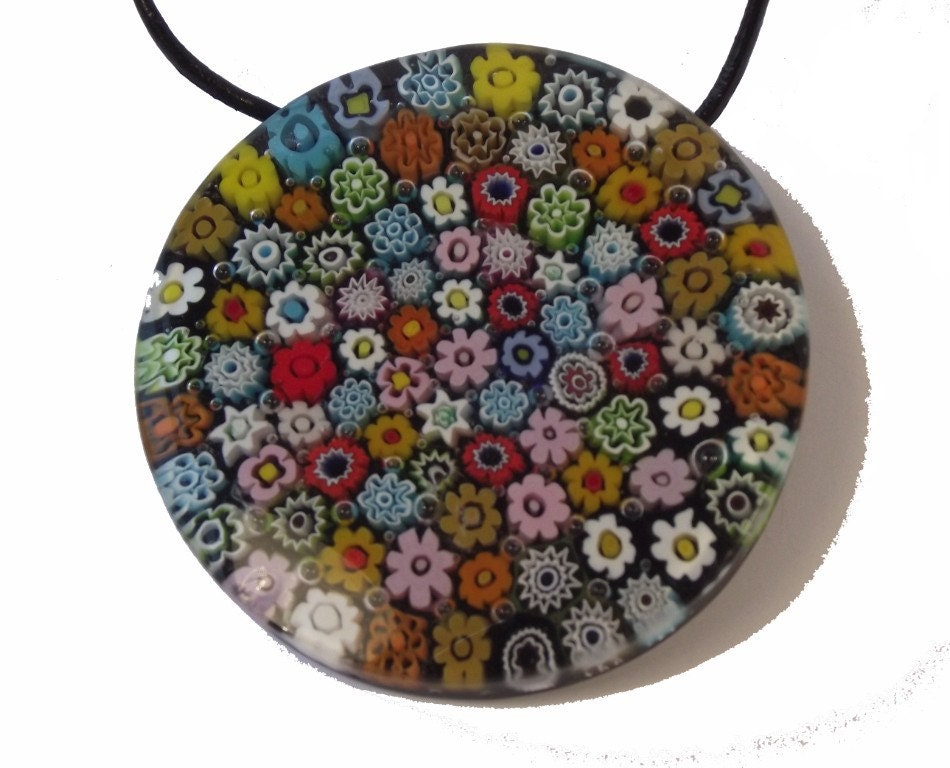 This large millefiori pendant is wonderfully detailed. It has a large sterling silver bail on the back.