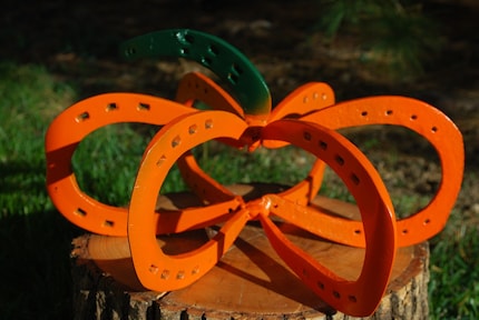 welded horseshoe art. 6 horseshoes make up the base,