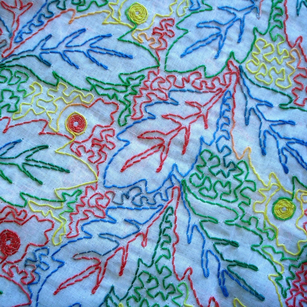 Fabric - muslin with embroidered leaf pattern - primary colors - 2 1/3 yards