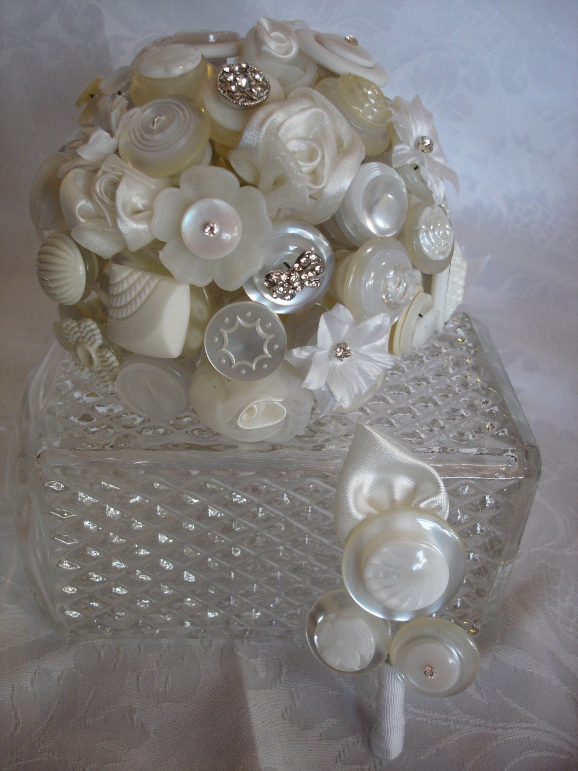 This bouquet is made with diamonte buttons silk flowers with diamonte 