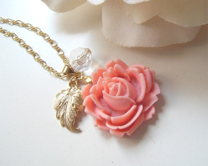 Rose Sunrise. Dainty pale pink rose bud pendant with brass leaf and clear crystal necklace