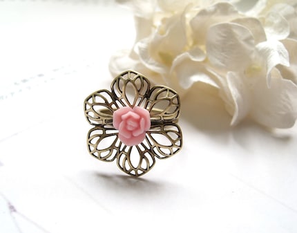 Gwen. Salmon pink rose bud with flower filigree antiqued brass adjustable ring