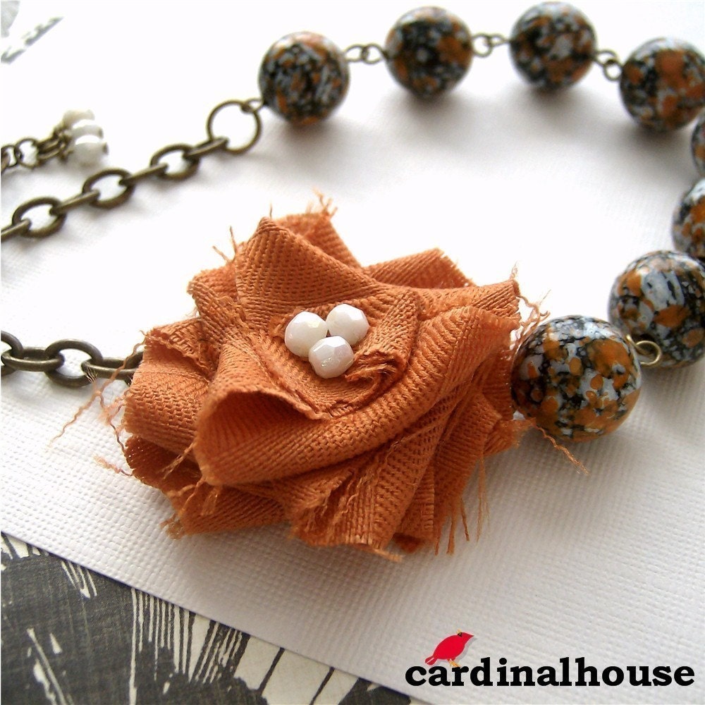 Rosa. Statement necklace with orange and white fabric flower and vintage speckled beads