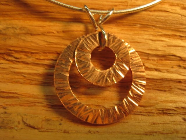 Mixed metal layered circles pendant in sterling silver and copper with sterling silver snake chain
