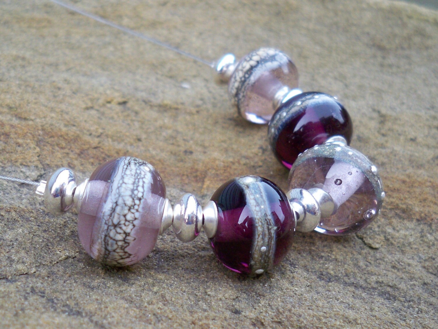 The beads in this necklace are made by myself, in my small North Yorkshire studio.