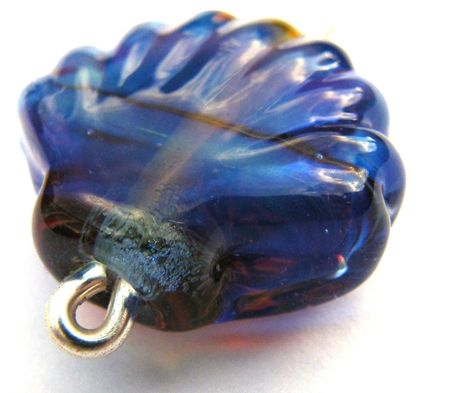 Large Shell Bead coated in clio which creates this fabulous purple and blue shimmer