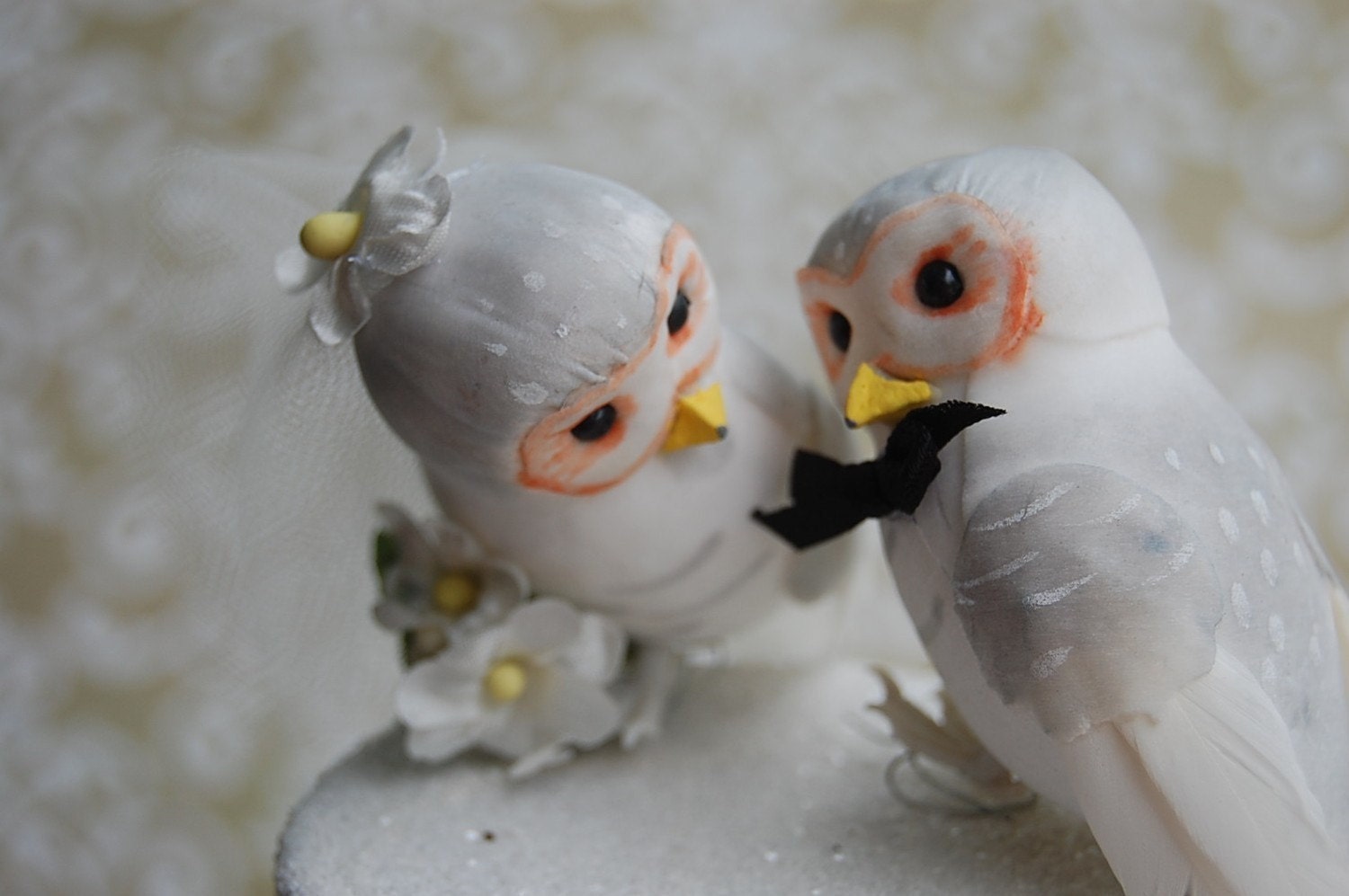 http://www.etsy.com/listing/57635506/snow-owl-love-birds-wedding-cake-topper