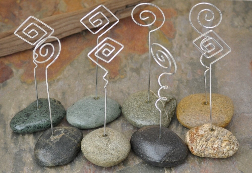 A fun mix of naturally formed beach rocks set with aluminum wire place card holders