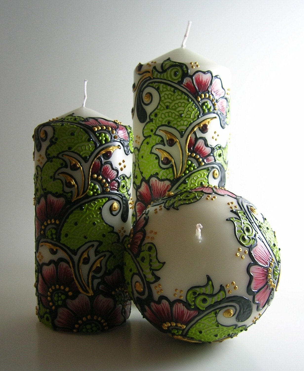 set of 3 henna inspired candles in cranberry red, pea green and buttery gold