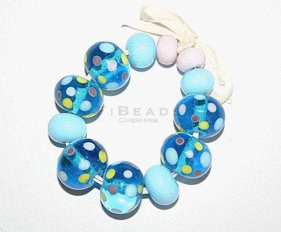 A set of 12 handcrafted lampwork beads