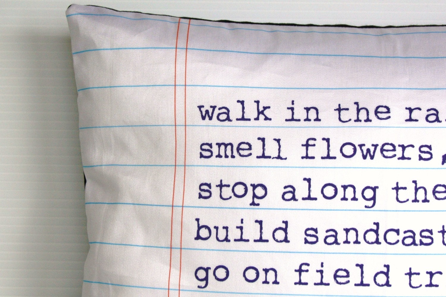 Organic cotton poem cushion, printed on notebook fabric
