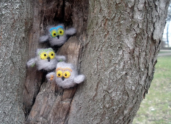 Tiny grey felted owls say Hello