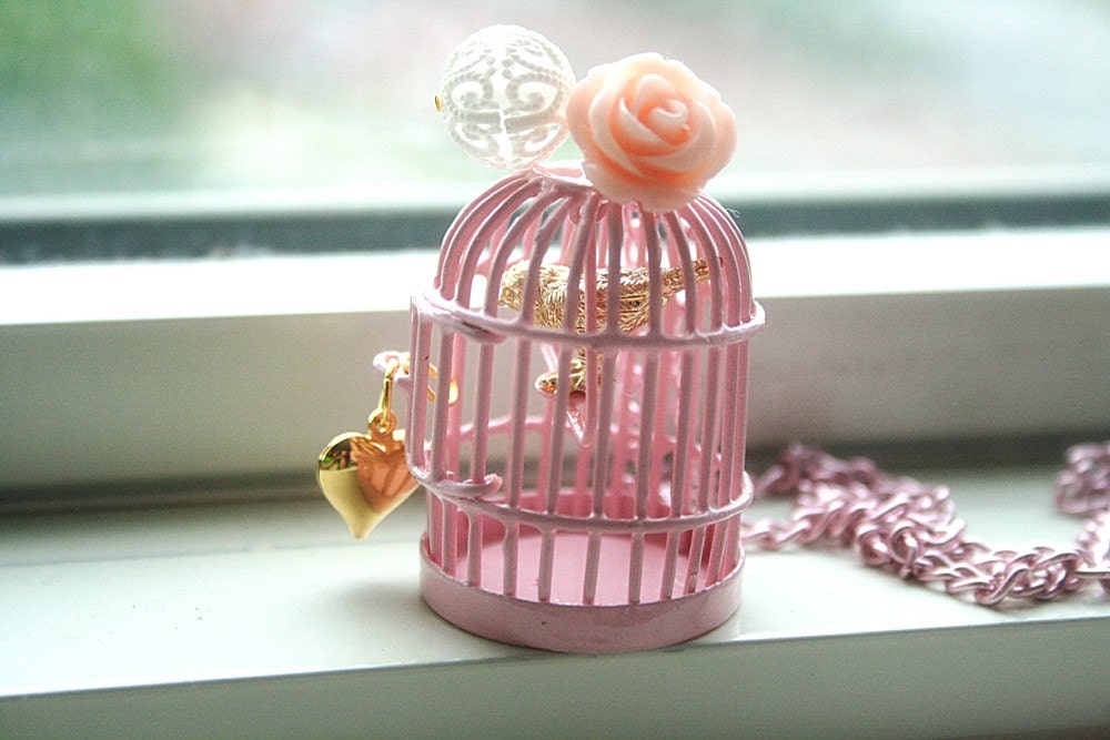 Golden bird inside pretty in pink cage necklace