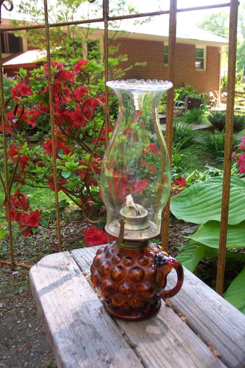 Vintage amber glass kerosene lamp