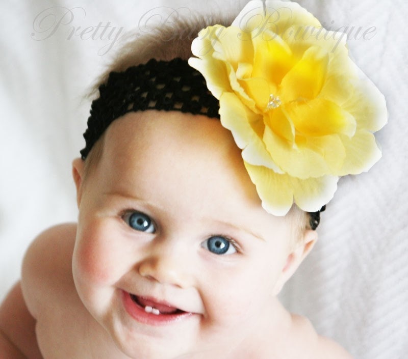 This is a beautiful yellow rose flower clip on a black crochet headband.