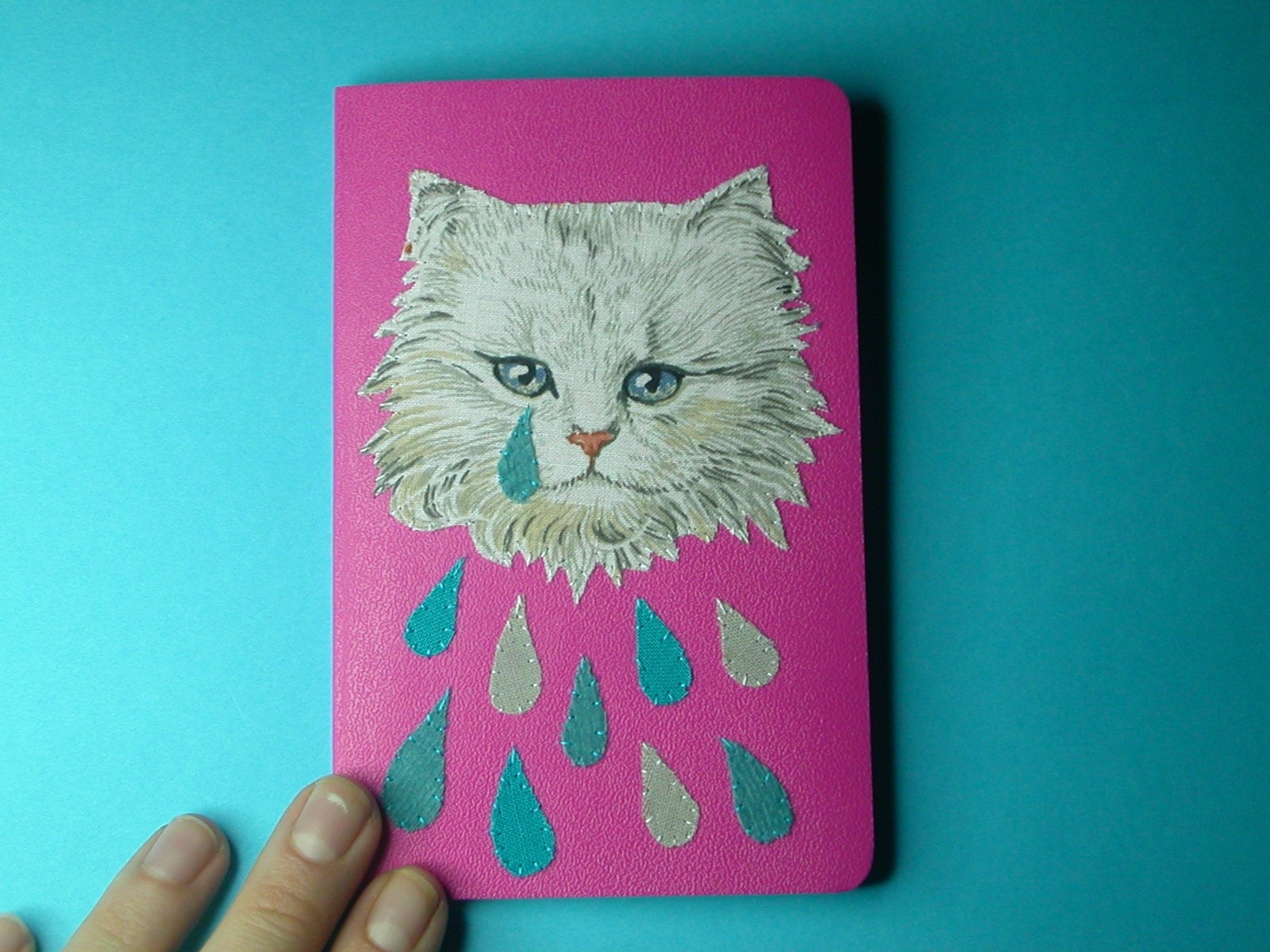 weeping kitten pocket notebook