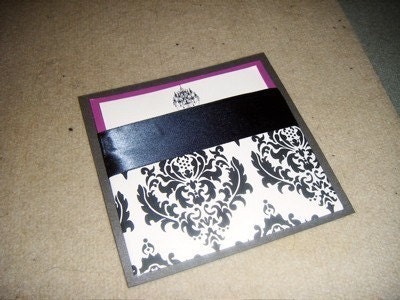 With a hint of magenta, the black and white damask print will have a modern 
