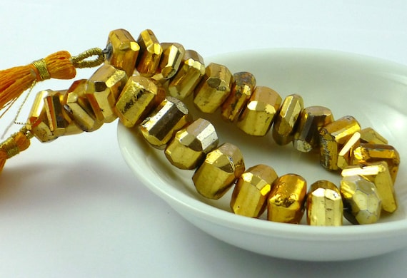 Gold coated faceted pyrite nuggets 10-12mm 1/4 strand