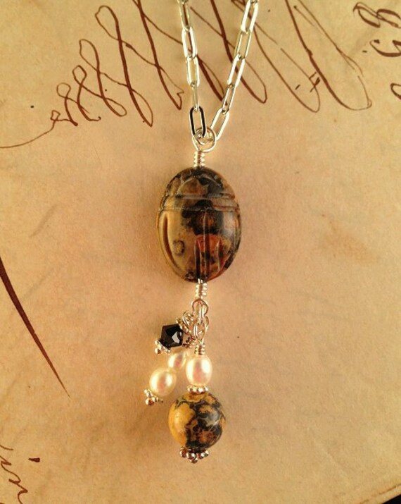 Carved scarab pendant necklace with leopard jasper, pearl, and crystal beads