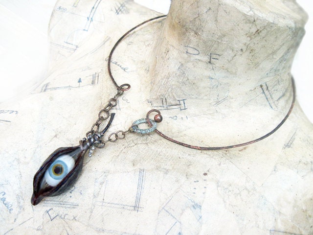 Among Empty Eternities. Glass Eye in Natural Pod with Hammered Choker.