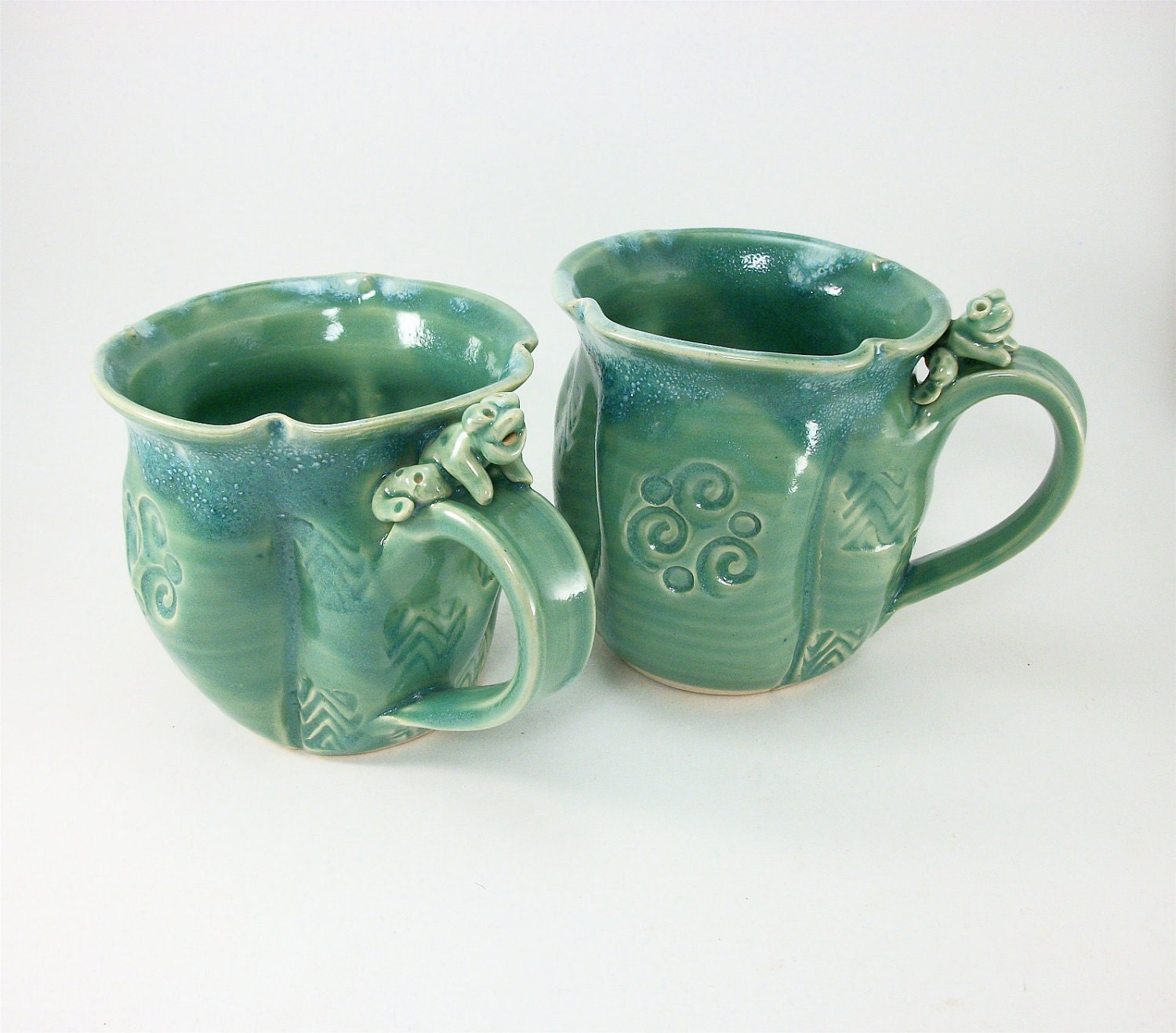 pair of jade colored frog mugs sold together